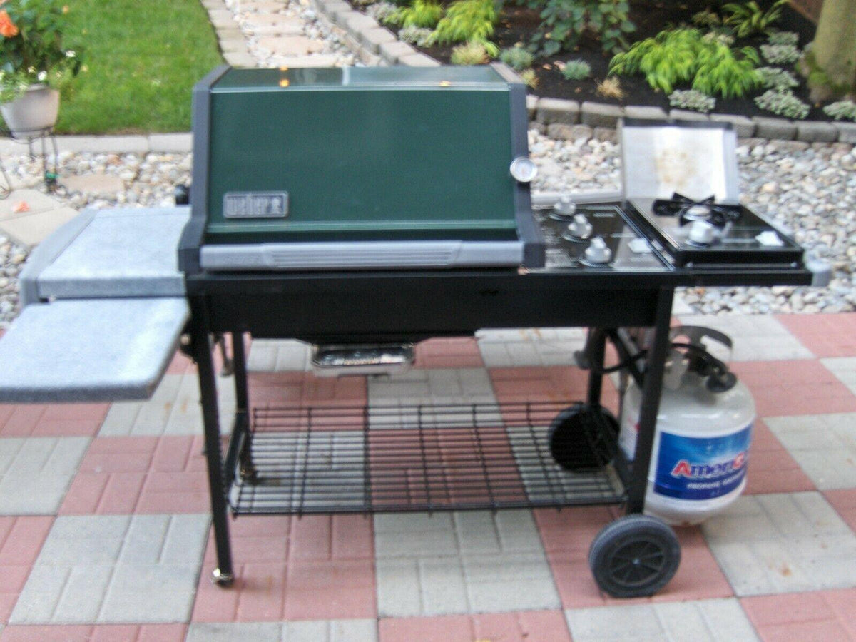 WEBER GAS GRILL GENESIS SILVER C WITH SIDE BURNER AND PROPANE TANK AND COVER
