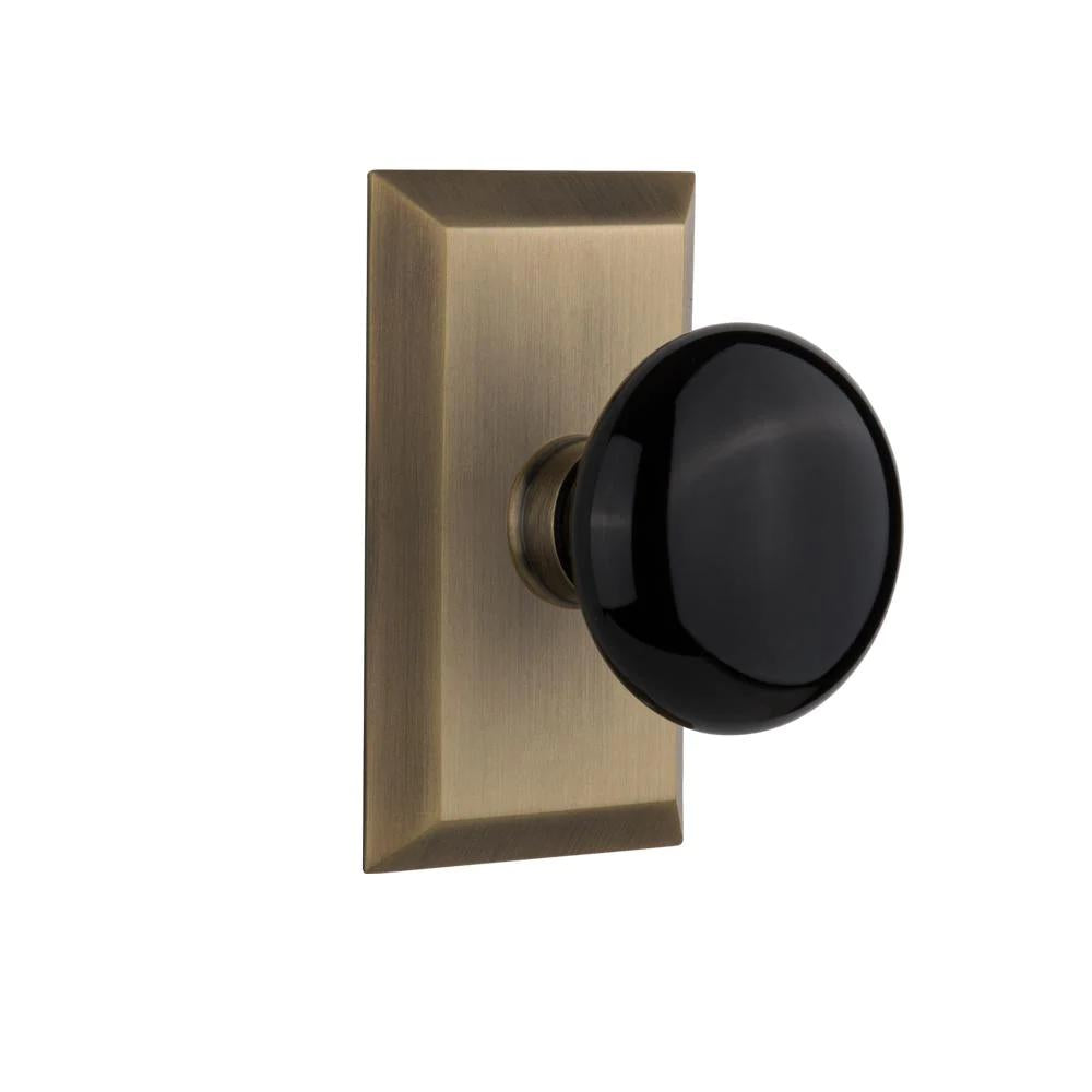 Studio Plate 2-3/4 in. Backset Antique Brass PassaHall/Closet Black Porcelain Door Knob