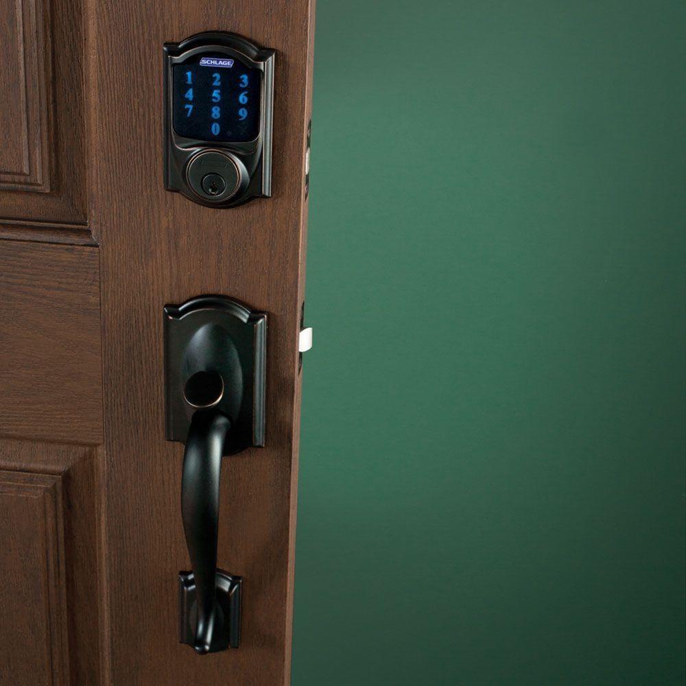 Bronze Connect Smart Deadbolt with Camelot Trim and Camelot Aged Entry Door Handle Set with Georgian Door Knob